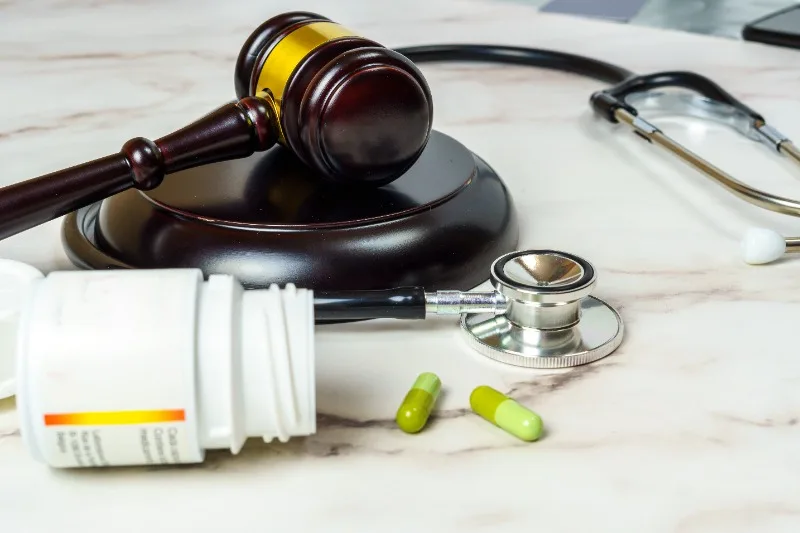 a gavel and a stethoscope on a table